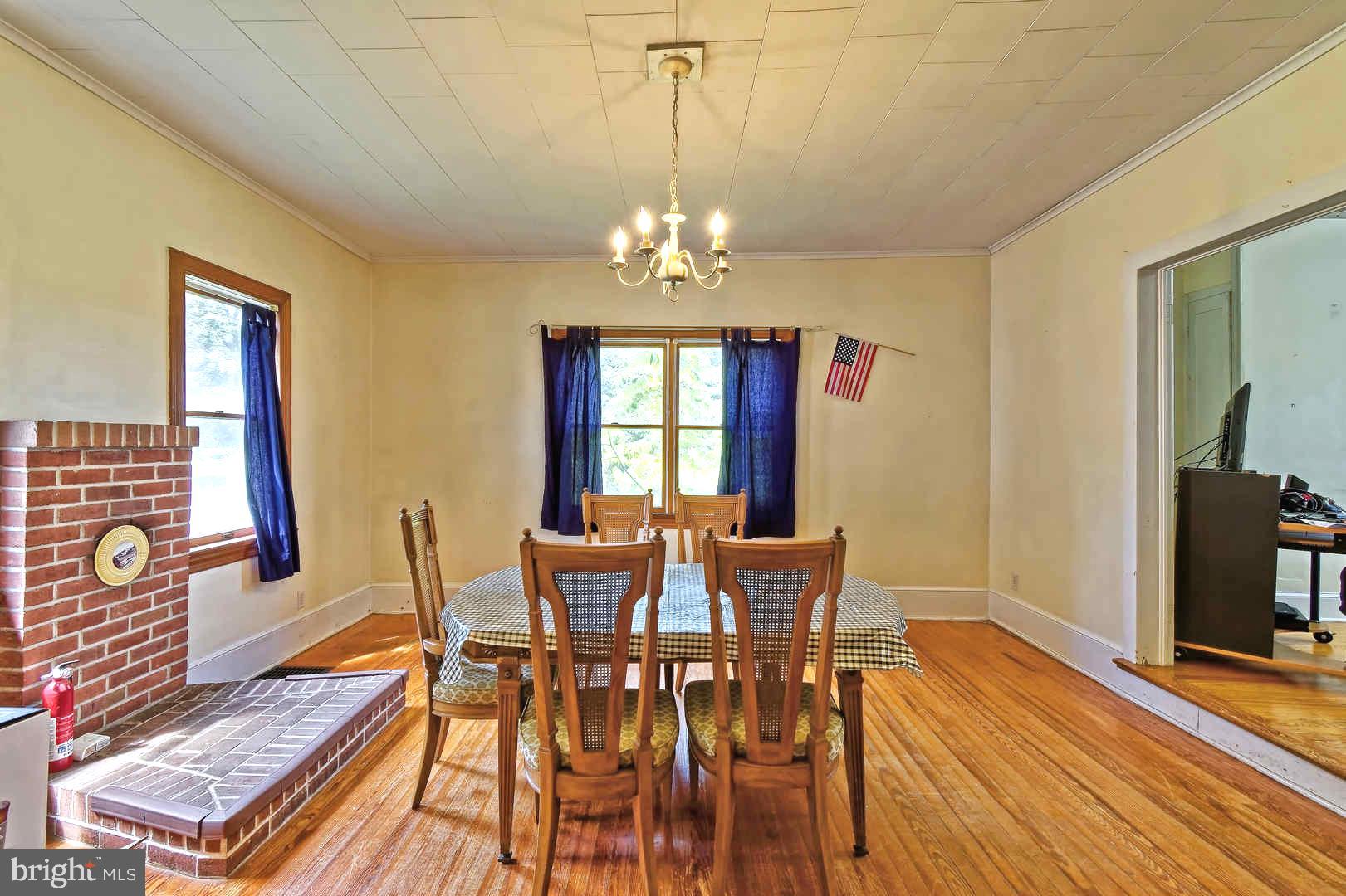 409 Cohansey Friesburg Road Alloway, NJ 08318 - Photo 12 of 25 Formal Dining room with brick hearth