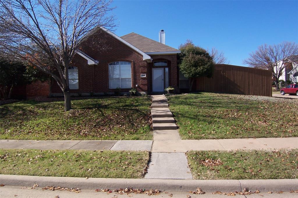 8301 Bells Street Frisco, TX 75035 - Photo 2 of 24 a front view of a house with a yard