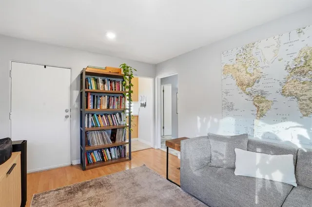 a living room with bookshelf and a book shelf