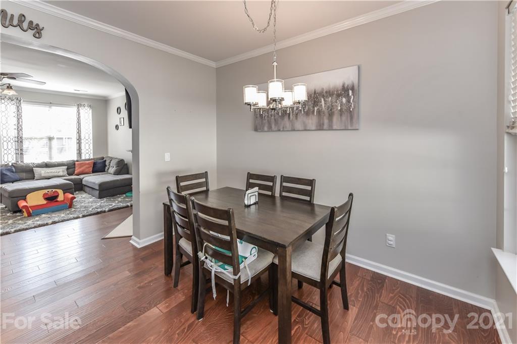 732 Shellstone Place, Unit 732 Fort Mill, SC 29708 - Photo 13 of 28 a view of a dining room with furniture and wooden floor