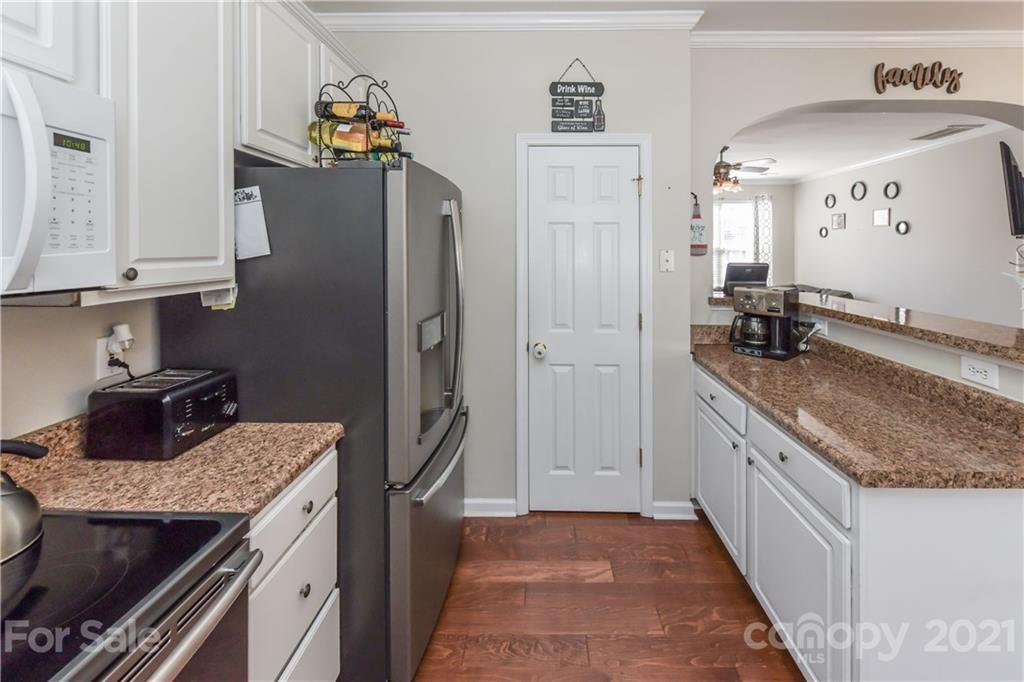 732 Shellstone Place, Unit 732 Fort Mill, SC 29708 - Photo 20 of 28 a kitchen with granite countertop a refrigerator and a sink