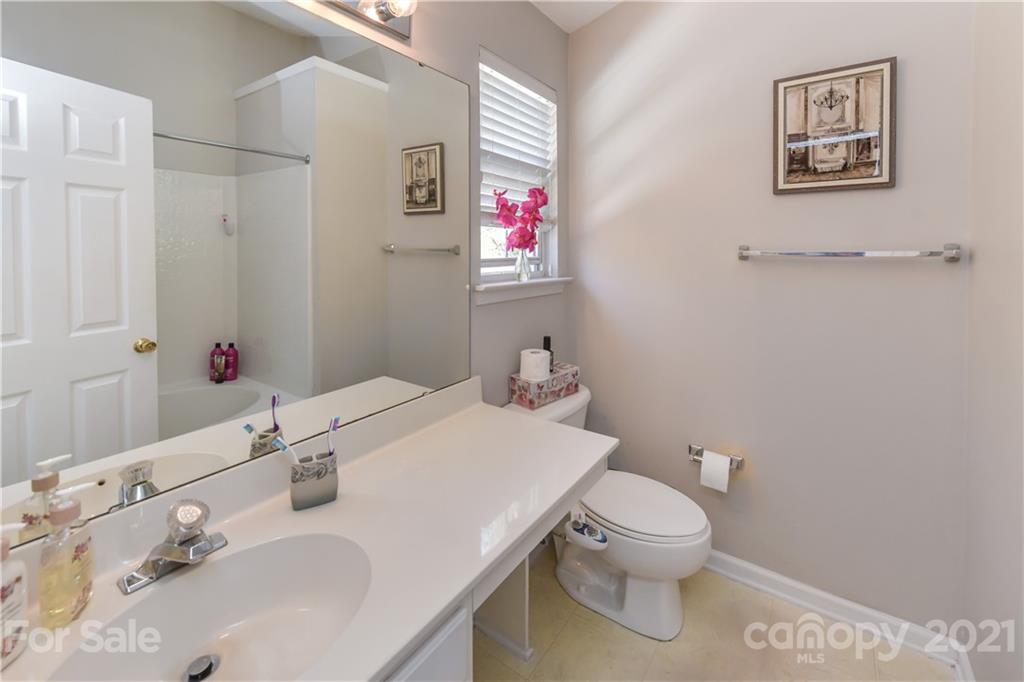732 Shellstone Place, Unit 732 Fort Mill, SC 29708 - Photo 27 of 28 a bathroom with a sink toilet and a mirror