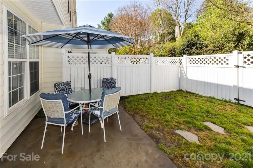 732 Shellstone Place, Unit 732 Fort Mill, SC 29708 - Photo 5 of 28 a view of a chairs and table in backyard
