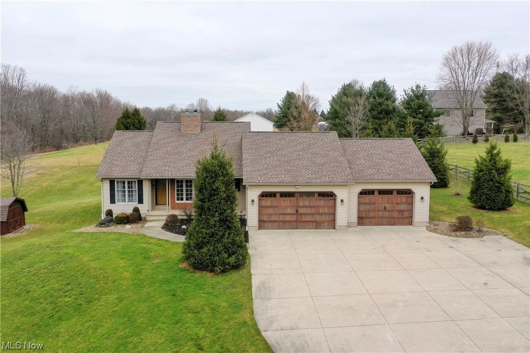 5659 State Rte 5 Ravenna, OH 44266 - Photo 1 of 48 Ranch-style house with a front lawn and a garage