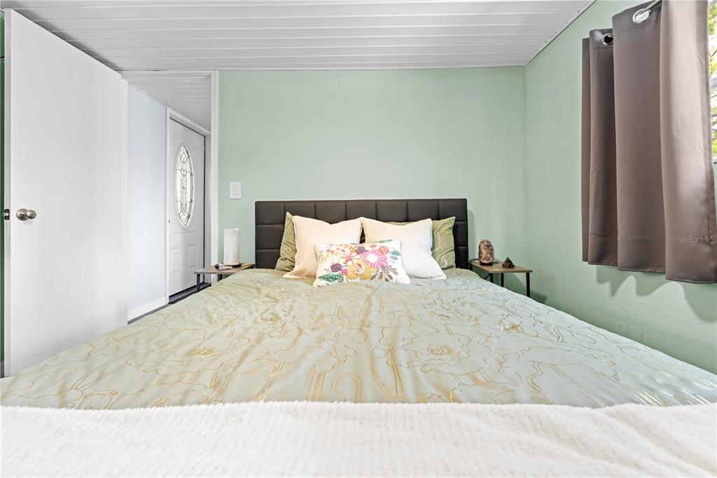 6380 Richard Drive Weeki Wachee, FL 34607 - Photo 31 of 59 a bedroom with a bed and a window