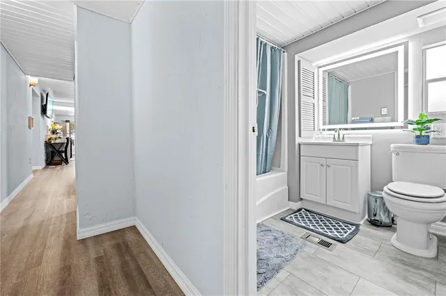 a bedroom with a bed running cycle and a window