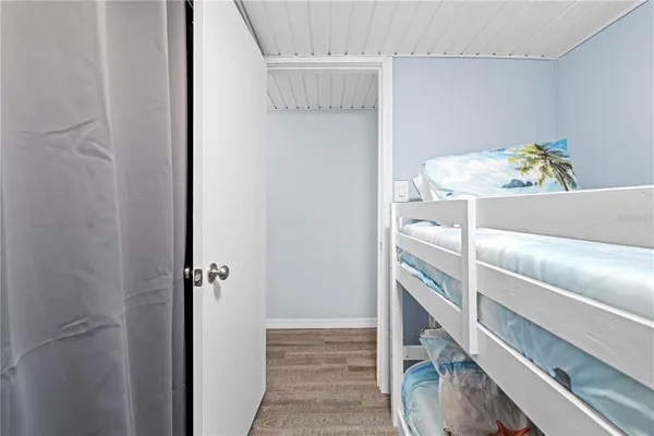 a bathroom with a toilet a sink and a mirror