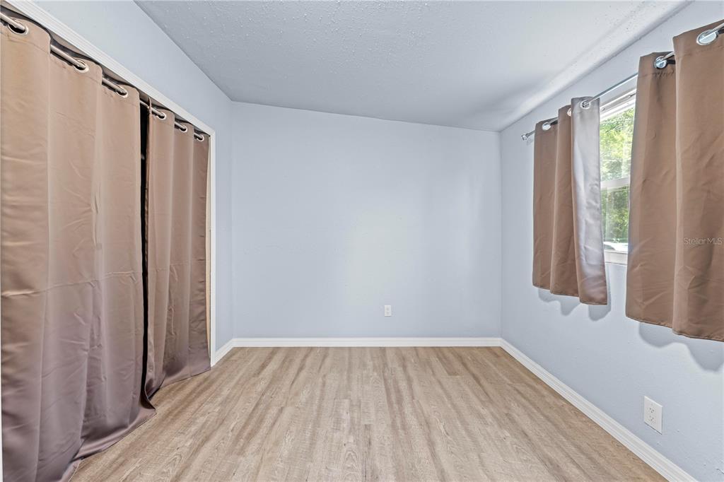 6380 Richard Drive Weeki Wachee, FL 34607 - Photo 41 of 59 a view of a room with wooden floor and a window