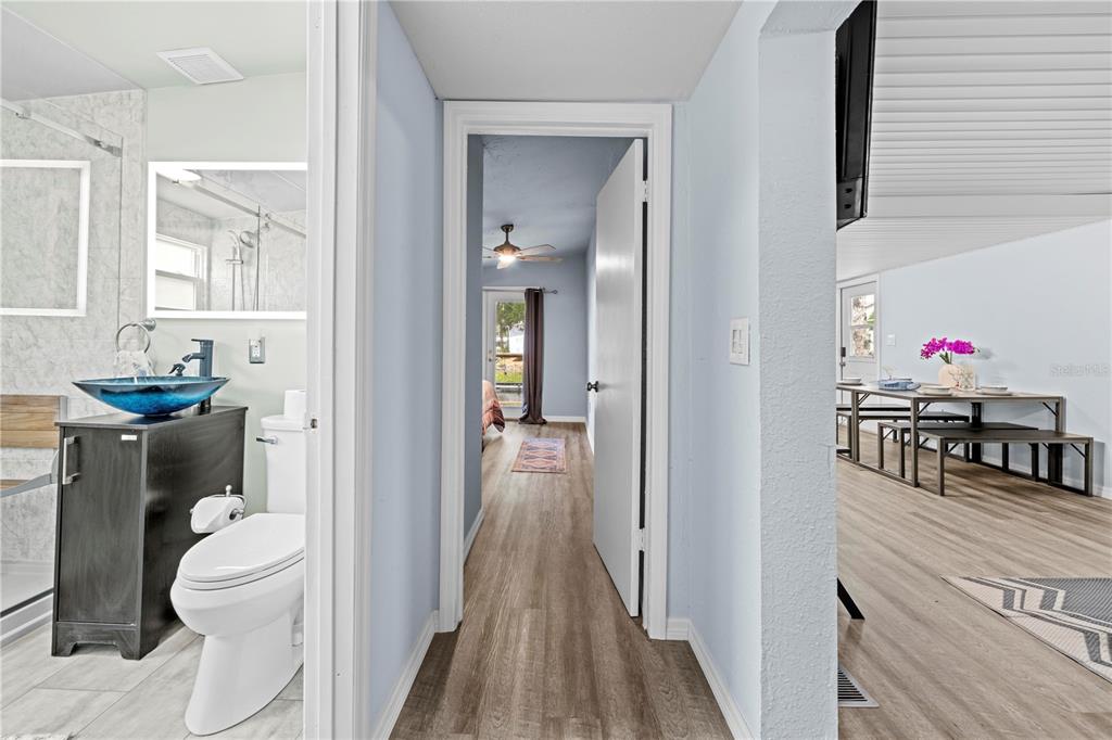 6380 Richard Drive Weeki Wachee, FL 34607 - Photo 43 of 59 a bathroom with a toilet a sink and a mirror