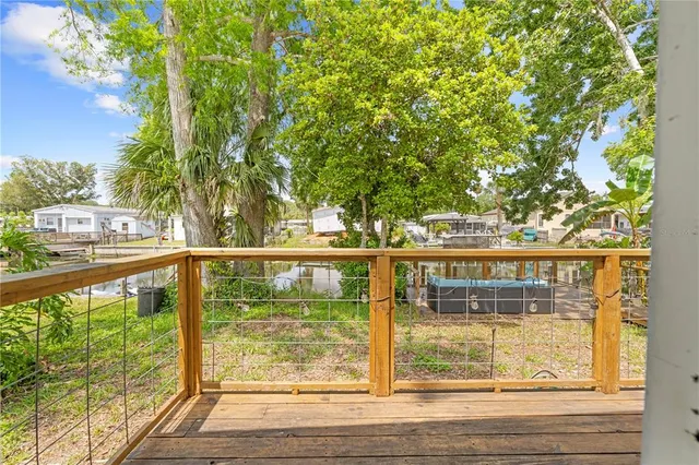 a kitchen with sink refrigerator dining table and chairs