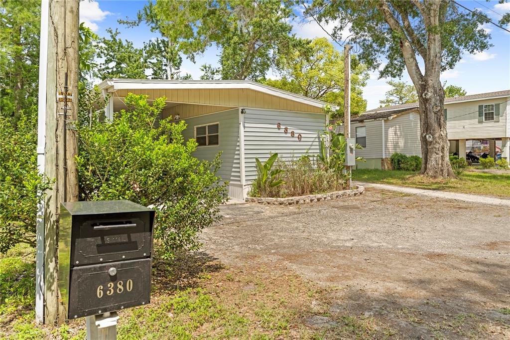 6380 Richard Drive Weeki Wachee, FL 34607 - Photo 5 of 59 a front view of a house with a yard and garage