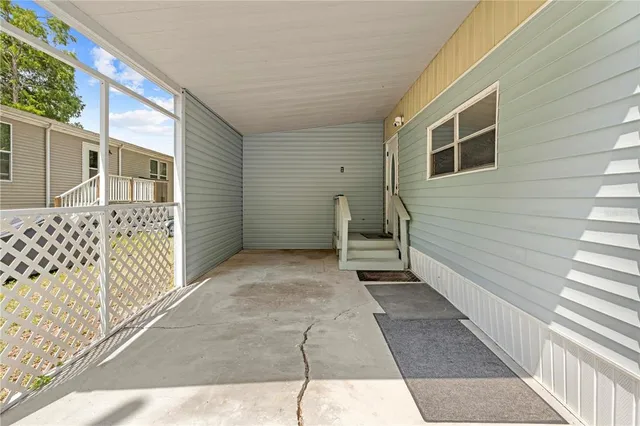 a view of a house with wooden fence