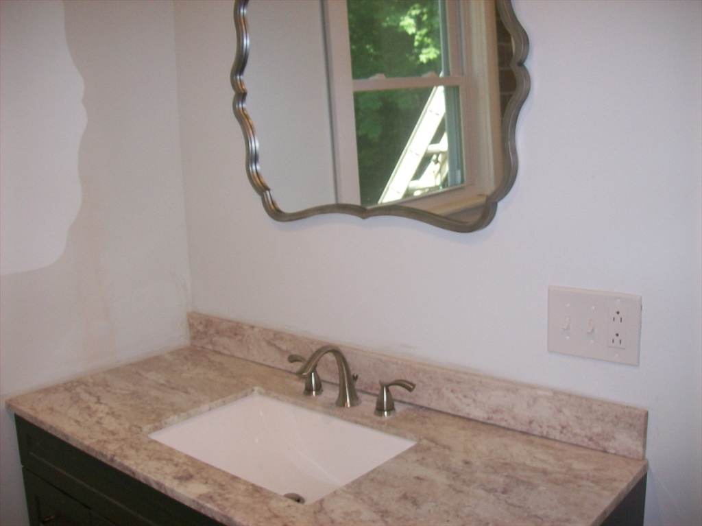 480 Pleasant Street Leicester, MA 01524 - Photo 11 of 17 a bathroom with a granite countertop sink and a mirror