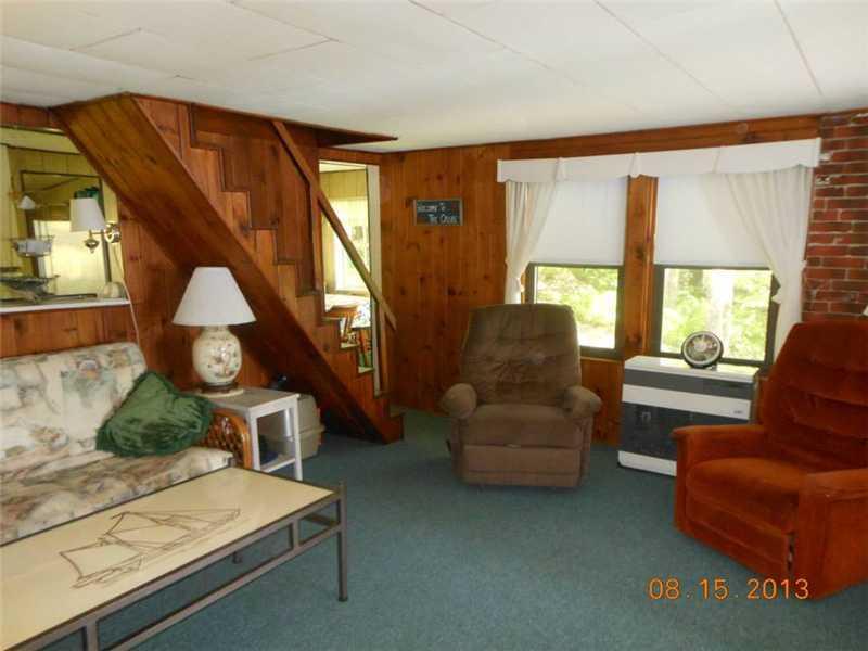 40 Rustic Drive Litchfield, ME 04350 - Photo 9 of 17 Living Room. The living room opens...