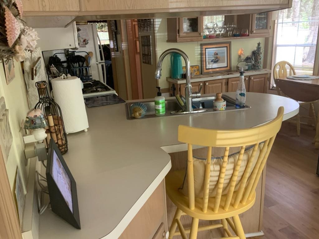 516 Highway 9 Marmora, NJ 08223 - Photo 6 of 14 a view of a dining room with furniture and chandelier