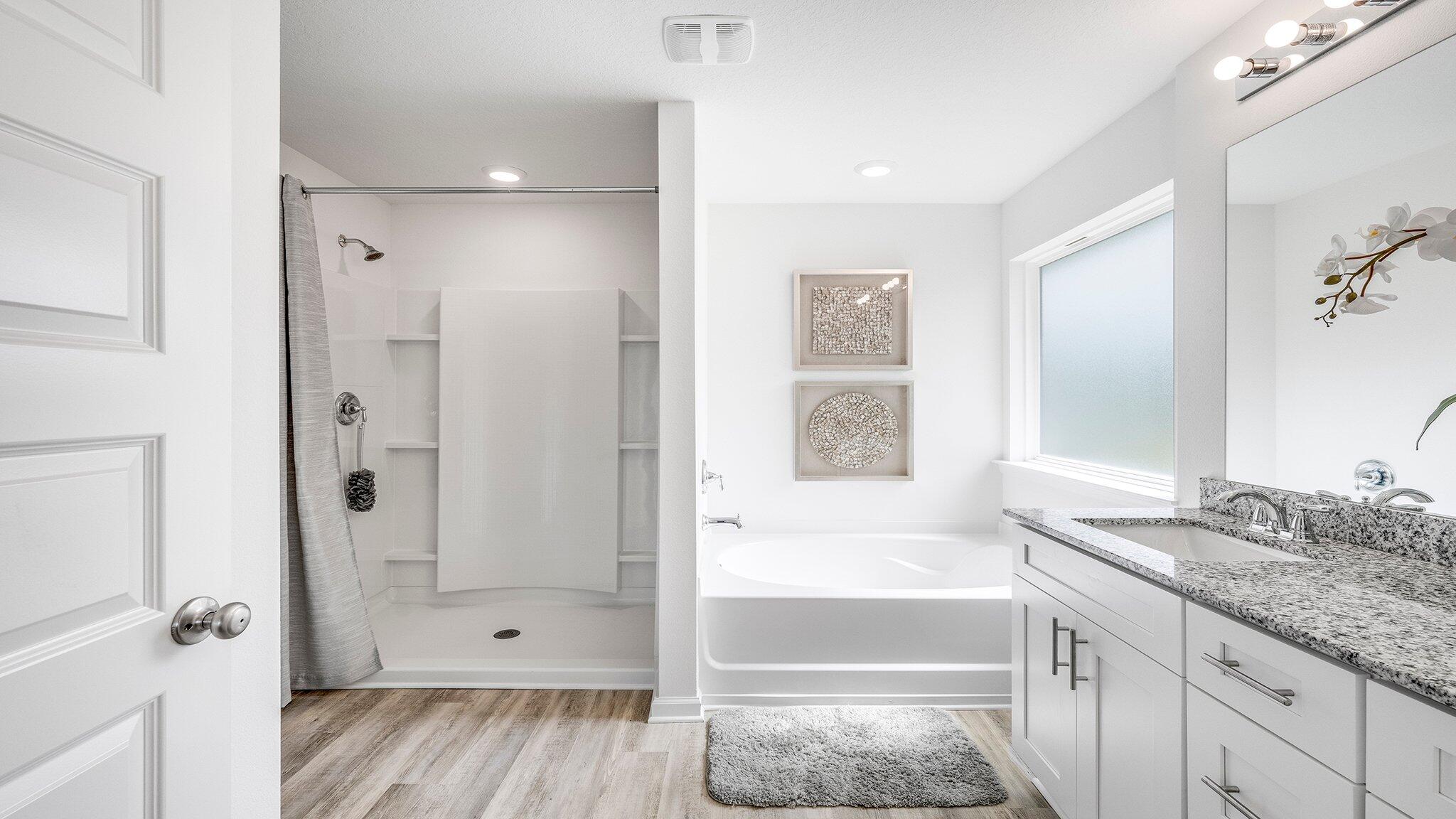 8 Bluebeech Street Freeport, FL 32439 - Photo 13 of 21 a bathroom with a granite countertop tub sink and shower