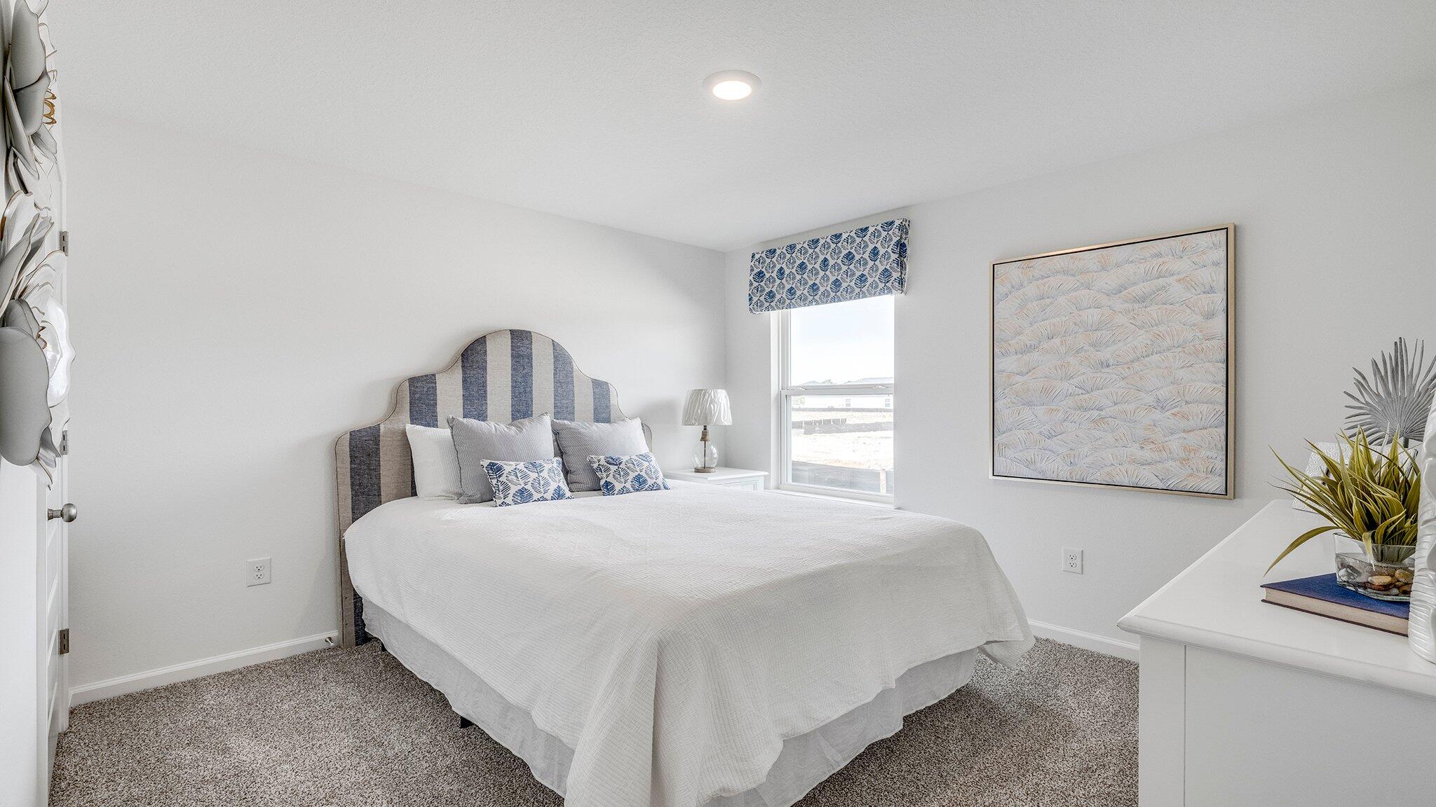 8 Bluebeech Street Freeport, FL 32439 - Photo 18 of 21 a bedroom with a bed and a table in it