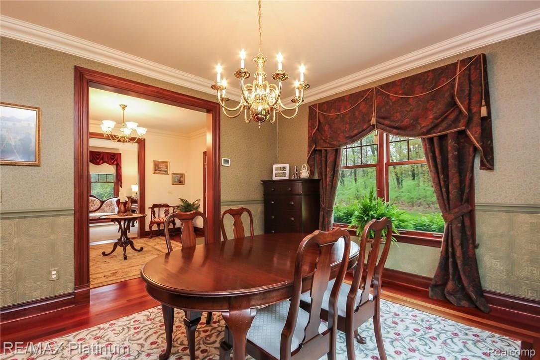 6945 Gawley Road Pinckney, MI 48169 - Photo 14 of 76 Crown mouldings and chair railings dress up this room