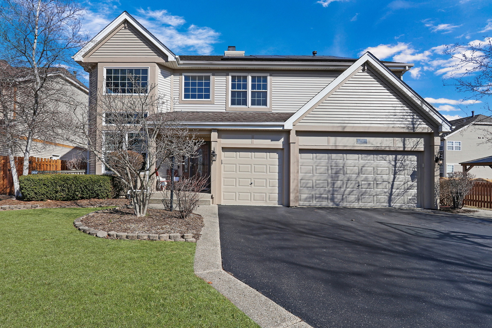 1135 Hadley Circle Gurnee, IL 60031 - Photo 1 of 60 a front view of a house with a yard