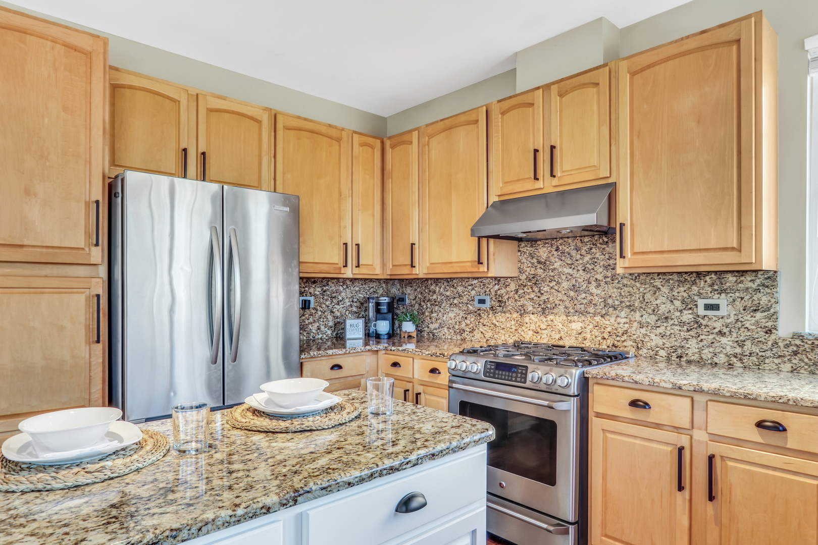 1135 Hadley Circle Gurnee, IL 60031 - Photo 16 of 60 a kitchen with granite countertop a sink stove and refrigerator
