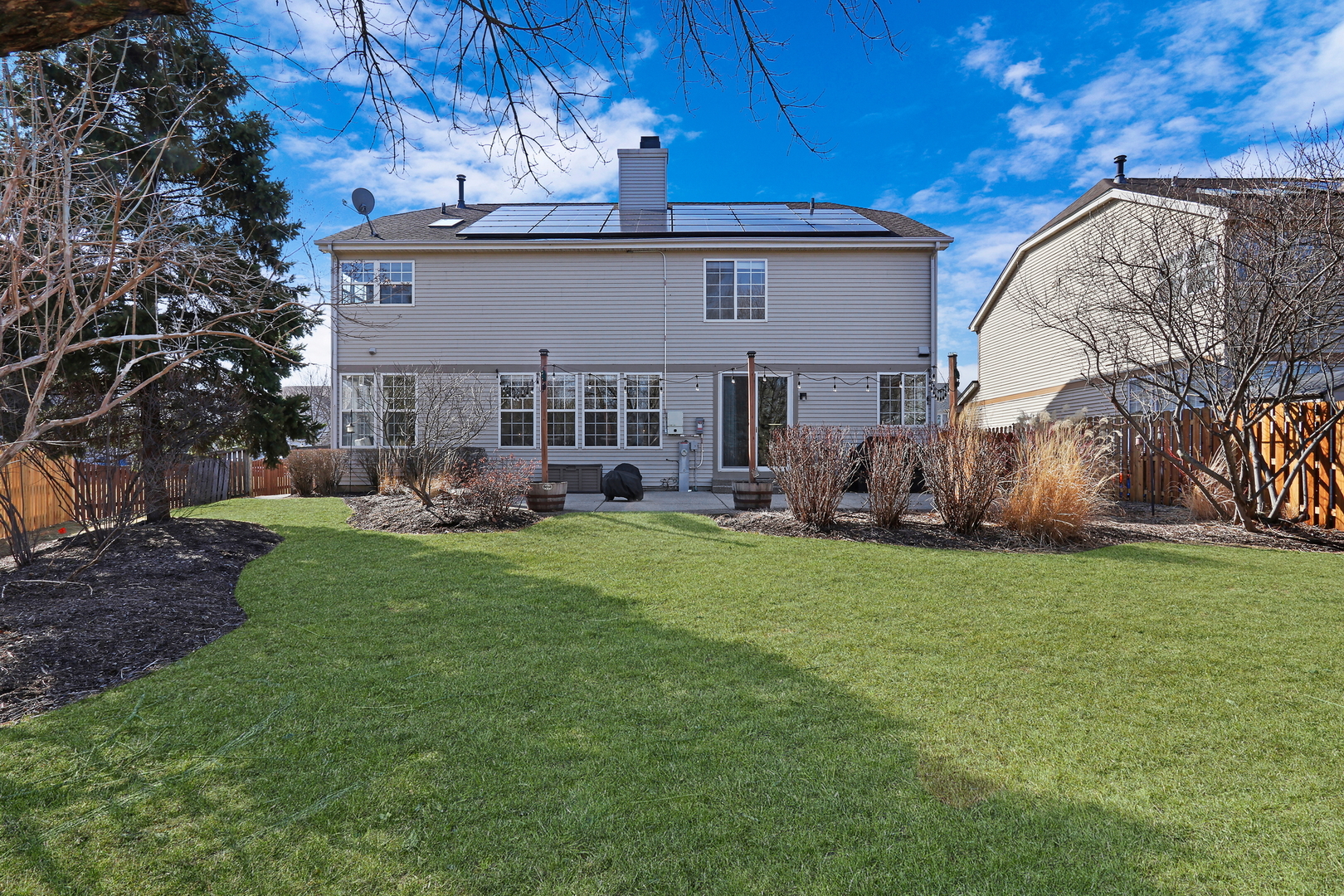 1135 Hadley Circle Gurnee, IL 60031 - Photo 2 of 60 a backyard of a house with table and chairs