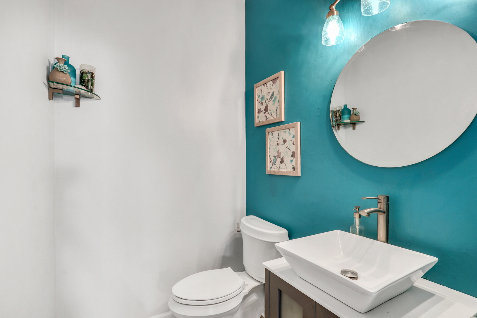 1135 Hadley Circle Gurnee, IL 60031 - Photo 26 of 60 a white toilet sitting next to a white sink and vanity