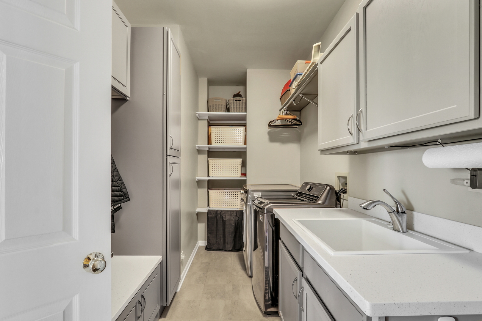 1135 Hadley Circle Gurnee, IL 60031 - Photo 28 of 60 a kitchen with a sink a stove and cabinets
