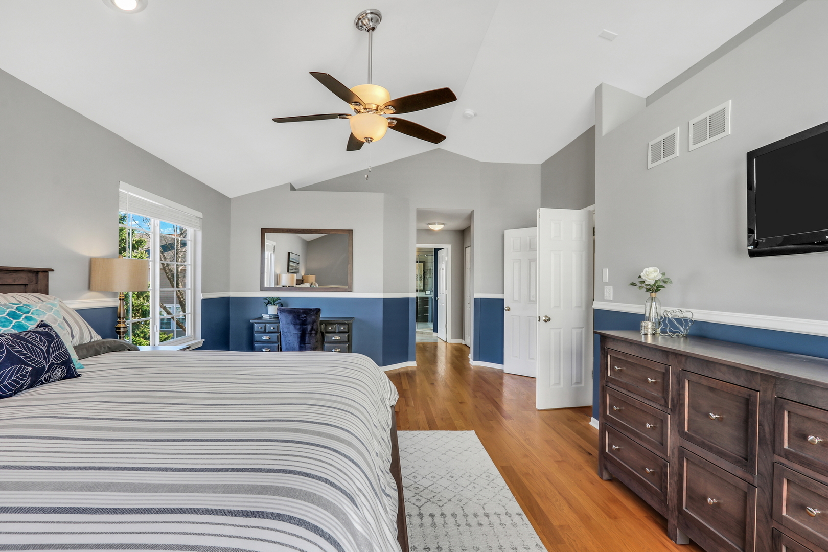 1135 Hadley Circle Gurnee, IL 60031 - Photo 33 of 60 a bedroom with a large bed and a flat tv screen on dresser