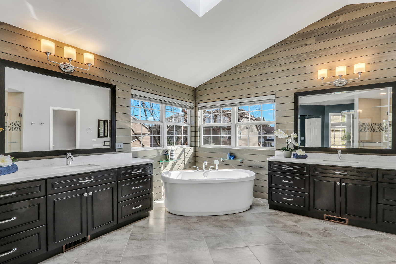 1135 Hadley Circle Gurnee, IL 60031 - Photo 34 of 60 a spacious bathroom with a tub sink and mirror