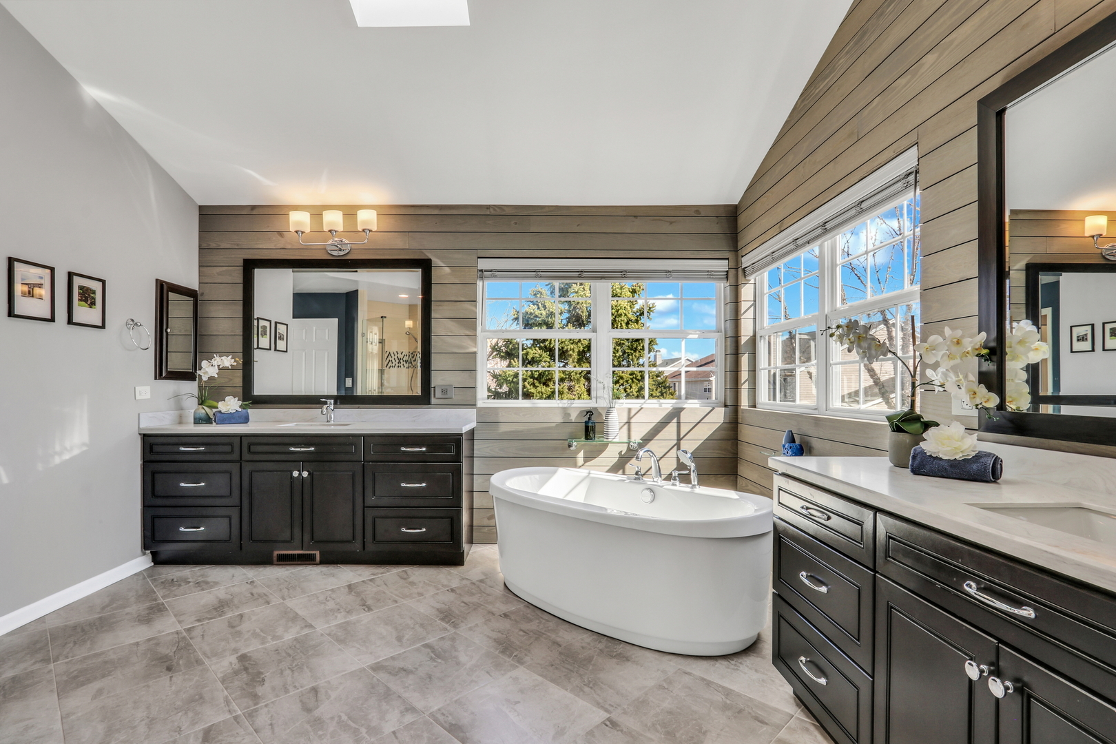1135 Hadley Circle Gurnee, IL 60031 - Photo 35 of 60 a spacious bathroom with a double vanity sink a large mirror and a bathtub