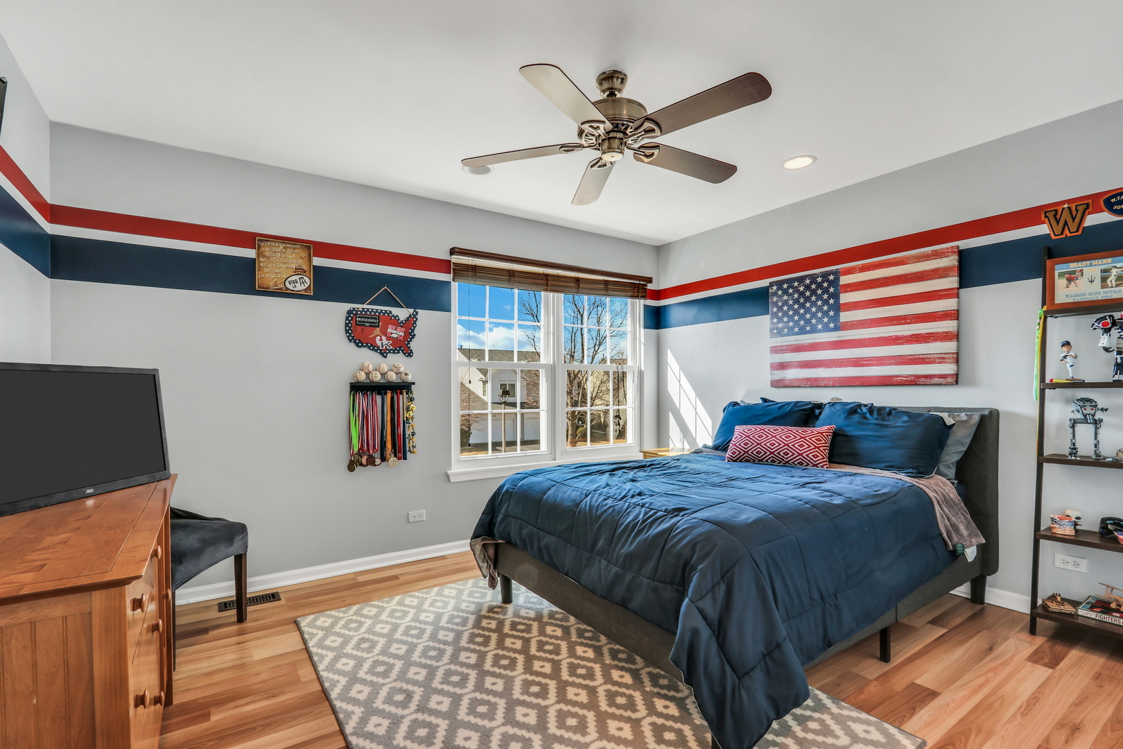 1135 Hadley Circle Gurnee, IL 60031 - Photo 39 of 60 a bedroom with a bed and a chandelier