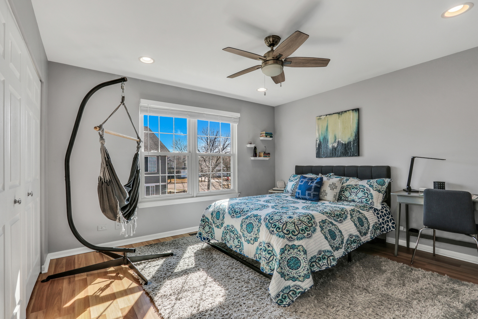 1135 Hadley Circle Gurnee, IL 60031 - Photo 40 of 60 a bedroom with a bed a couch and a chandelier