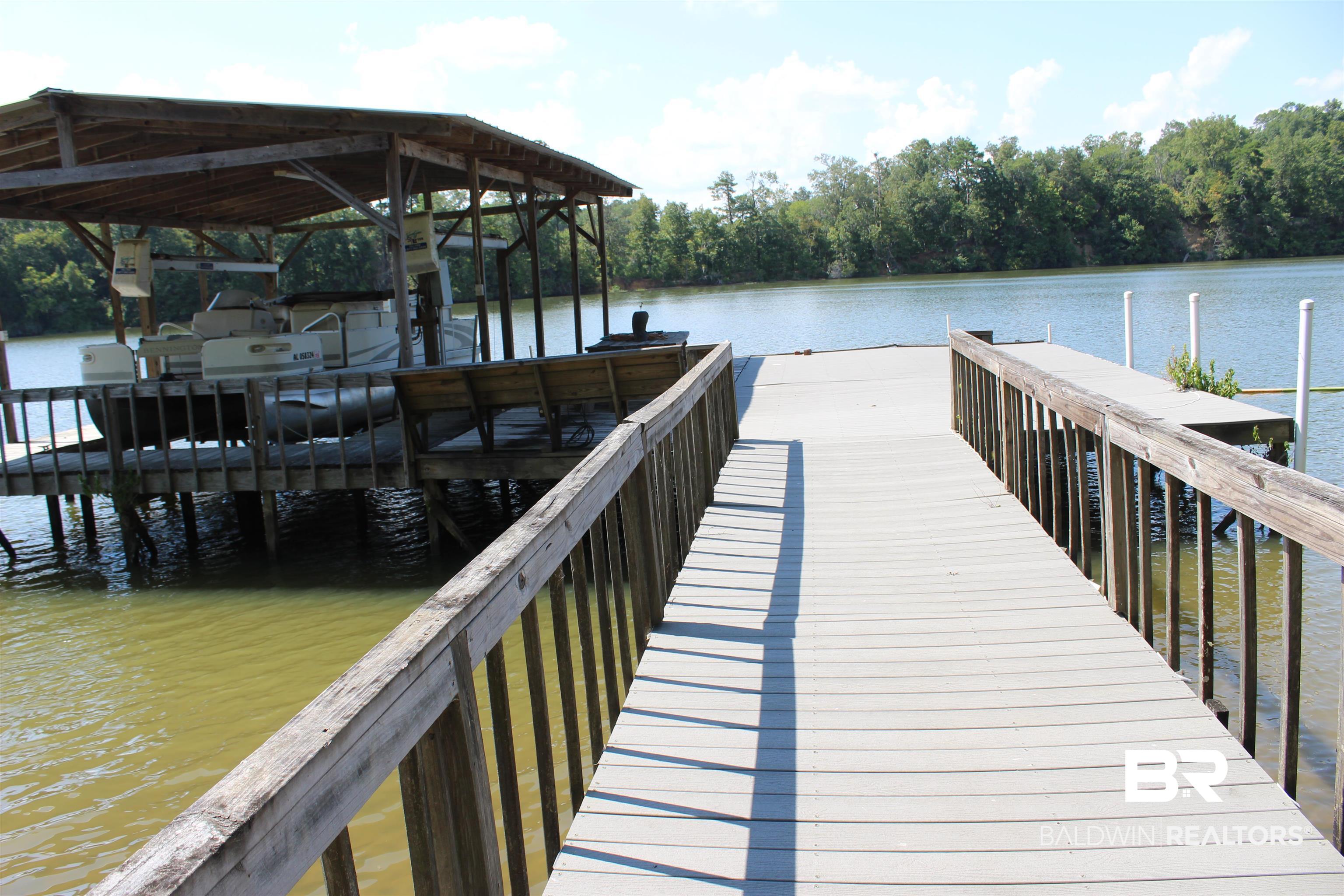 7258 Henderson Road Lowndesboro, AL 36752 - Photo 3 of 22 Dock area featuring a water view and a view of trees