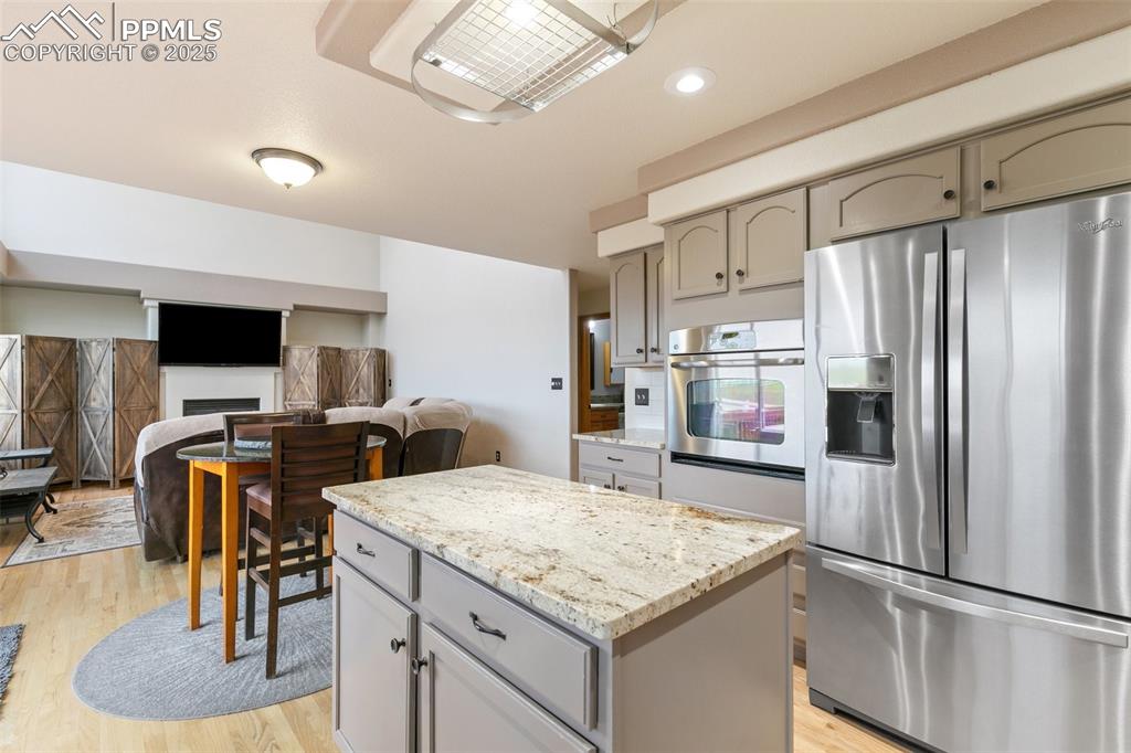 11960 Conestoga Trail South Elbert, CO 80106 - Photo 12 of 49 a kitchen with stainless steel appliances granite countertop a refrigerator and a stove top oven