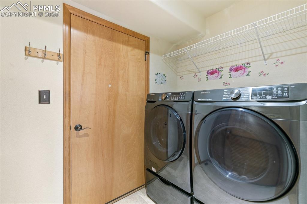 11960 Conestoga Trail South Elbert, CO 80106 - Photo 20 of 49 a utility room with dryer and washer