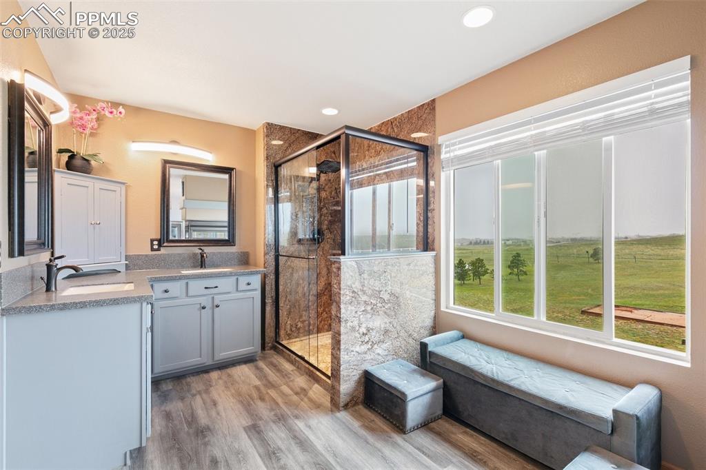 11960 Conestoga Trail South Elbert, CO 80106 - Photo 24 of 49 a spacious bathroom with sinks mirror and view