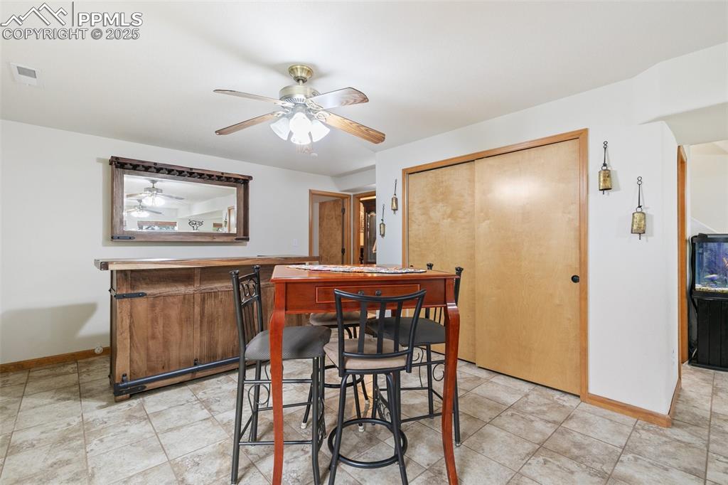 11960 Conestoga Trail South Elbert, CO 80106 - Photo 31 of 49 a view of a dining room with furniture and chandelier