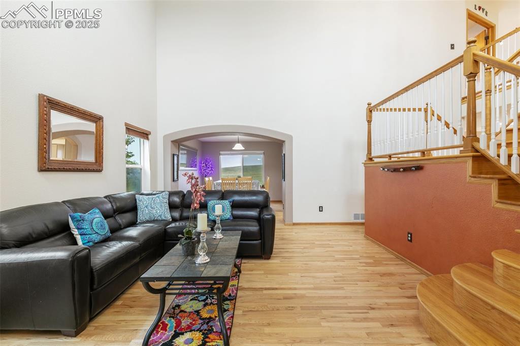 11960 Conestoga Trail South Elbert, CO 80106 - Photo 5 of 49 a living room with furniture and a wooden floor
