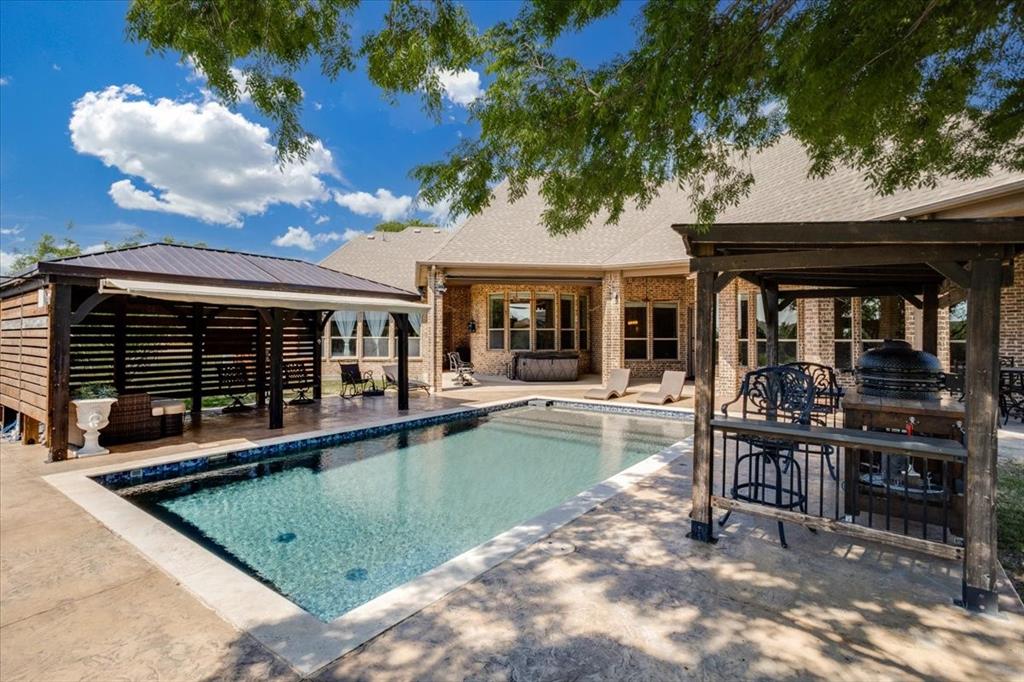 Outdoor pool featuring a patio and a gazebo