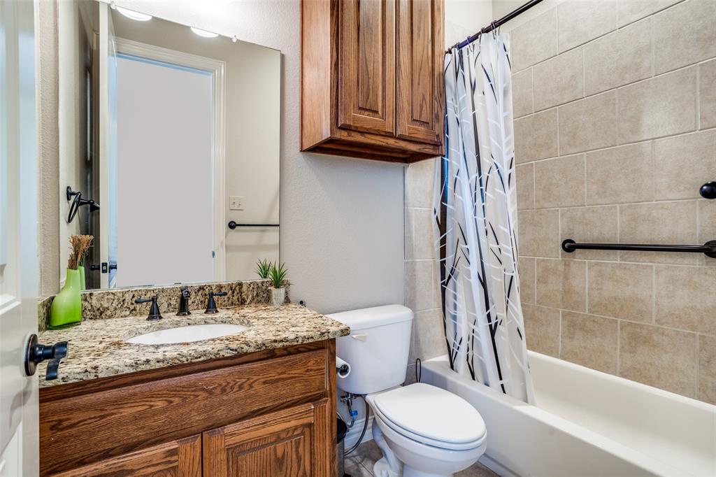1929 Canyon Road Celina, TX 75009 - Photo 21 of 39 Full bathroom featuring vanity and shower / tub combo with curtain