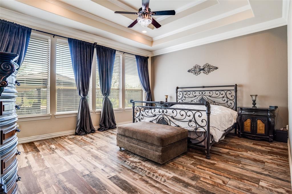1929 Canyon Road Celina, TX 75009 - Photo 22 of 39 Bedroom with wood finished floors, ceiling fan, and crown molding