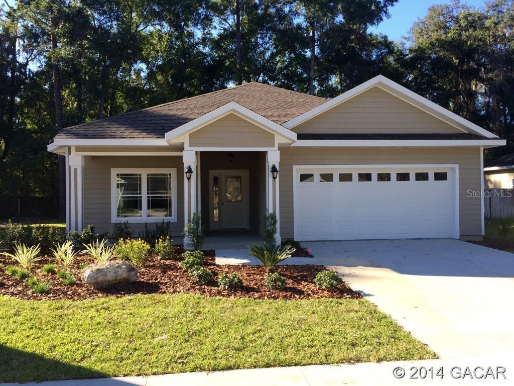 1850 Southwest 66th Drive Gainesville, FL 32607 - Photo 1 of 1 a front view of a house with a yard
