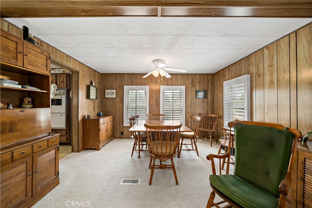 33950 Plowshare Road Wildomar, CA 92595 - Photo 15 of 62 a dining room with furniture and large windows