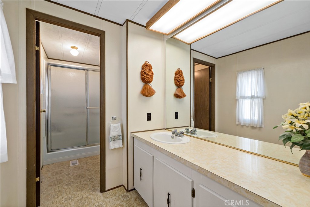 33950 Plowshare Road Wildomar, CA 92595 - Photo 32 of 62 a bathroom with a sink and a mirror
