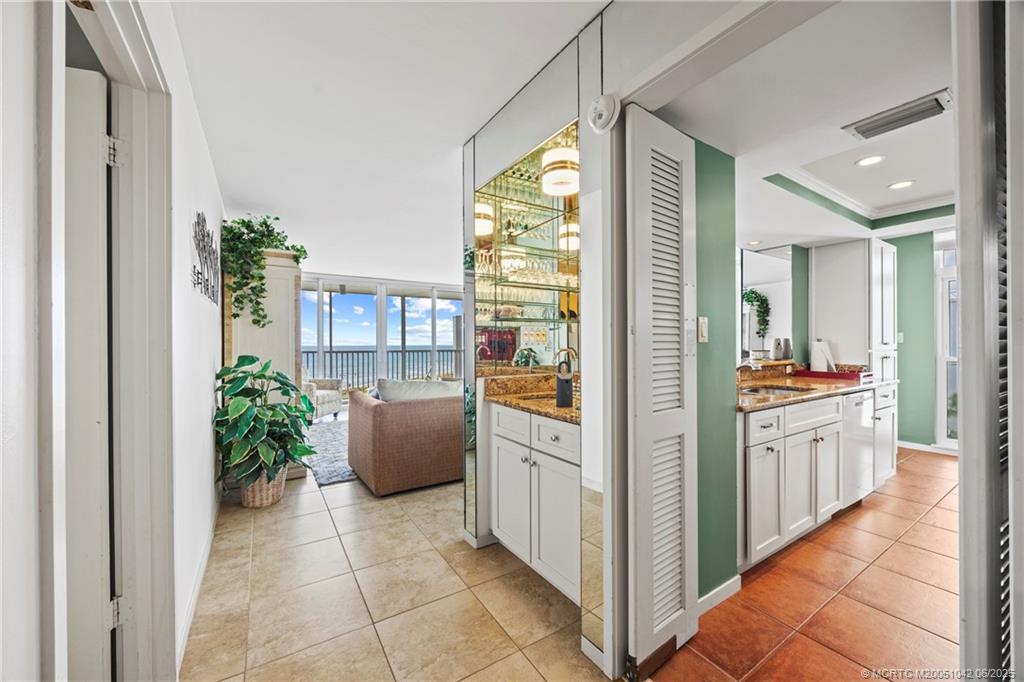 669 Northeast Plantation Road, Unit 405 Stuart, FL 34996 - Photo 14 of 34 a view of a kitchen with furniture and windows