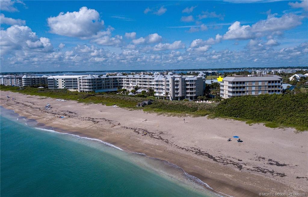669 Northeast Plantation Road, Unit 405 Stuart, FL 34996 - Photo 2 of 34 a view of a street with a building in the background