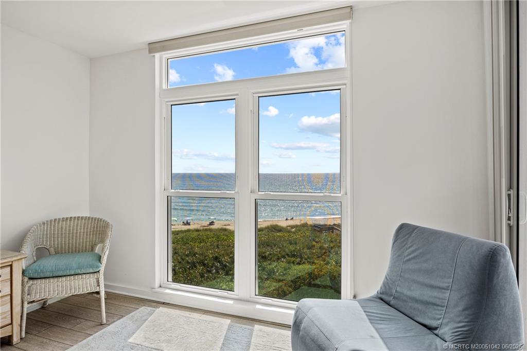 669 Northeast Plantation Road, Unit 405 Stuart, FL 34996 - Photo 26 of 34 a living room with furniture and a window