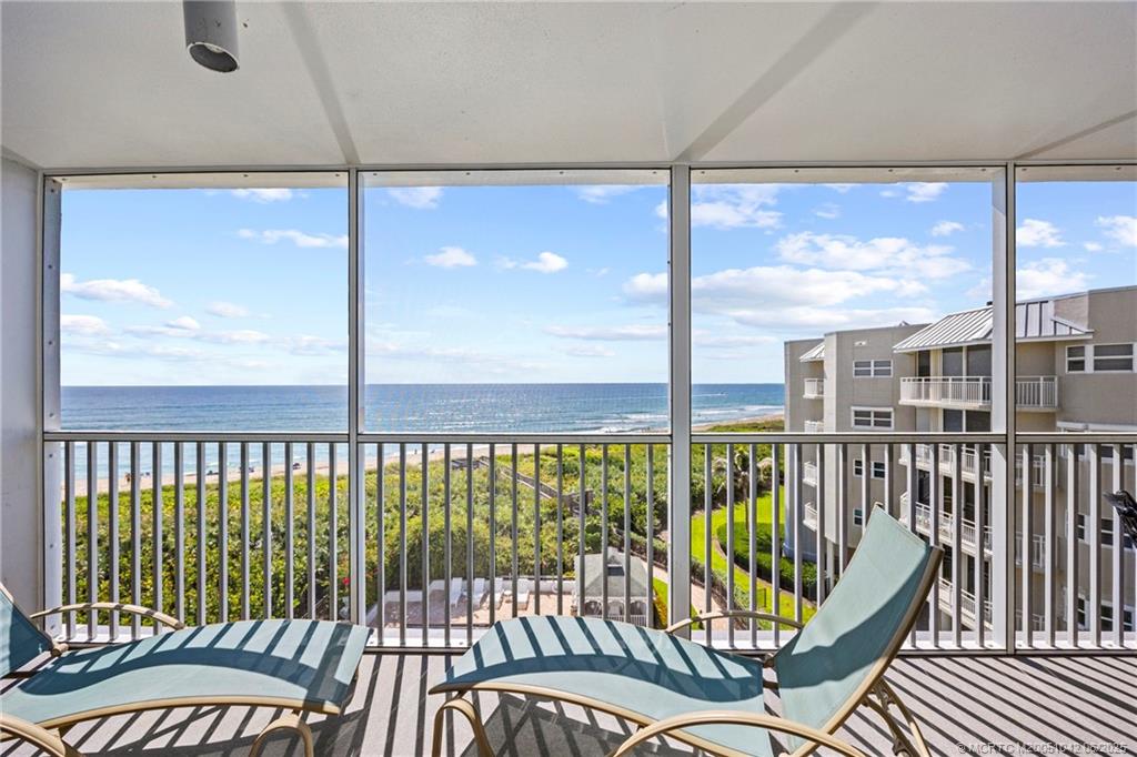 669 Northeast Plantation Road, Unit 405 Stuart, FL 34996 - Photo 9 of 34 a view of a balcony with furniture