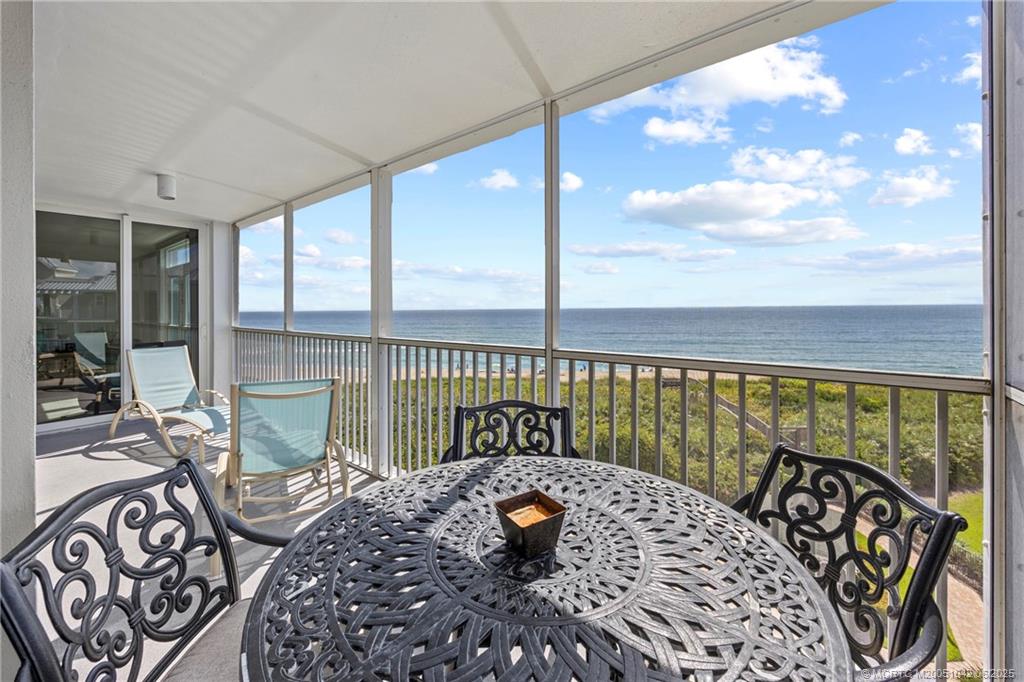 669 Northeast Plantation Road, Unit 405 Stuart, FL 34996 - Photo 10 of 34 a bedroom with furniture and a large window