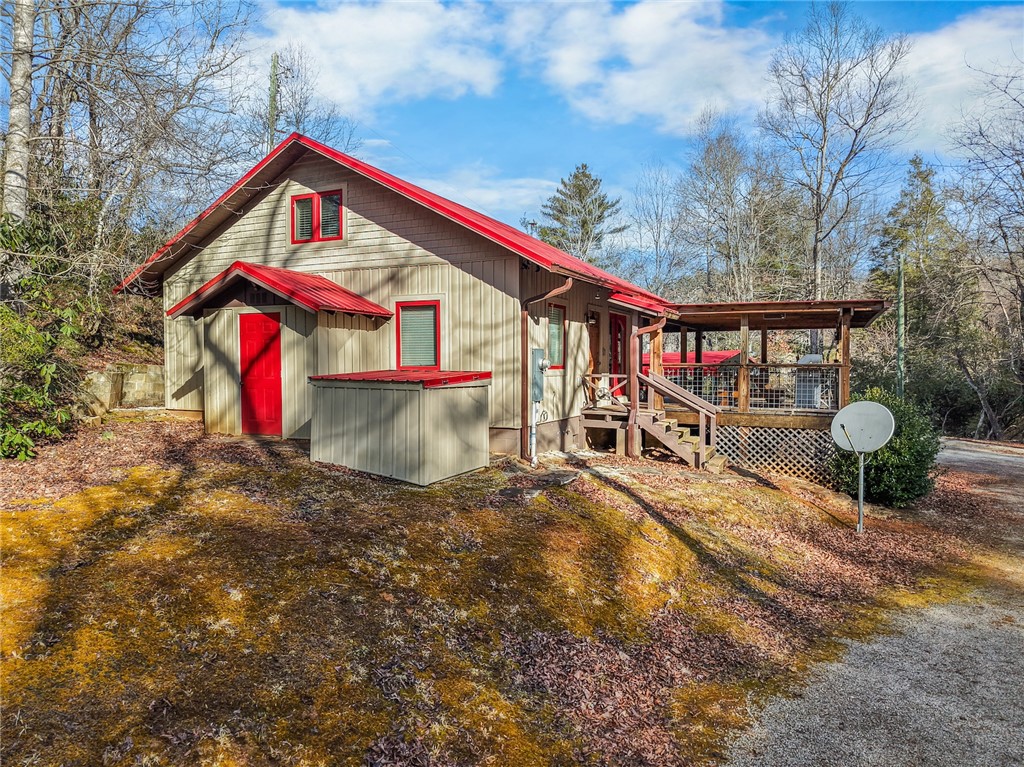 260 Hickory Ridge Mountain Rest, SC 29664 - Photo 25 of 39 This cozy woodland retreat features a charming exterior with a spacious deck, perfect for outdoor enjoyment.